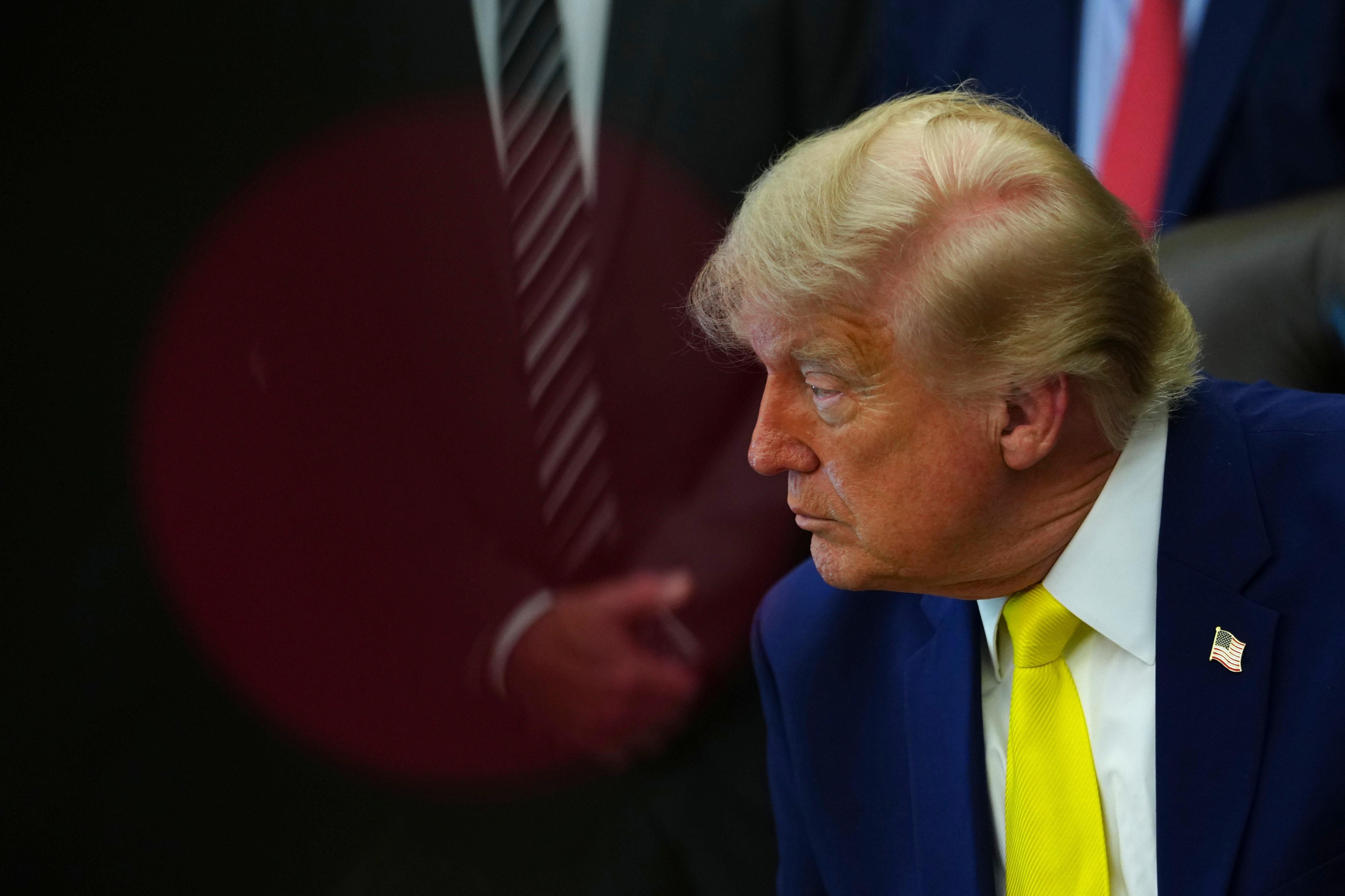 President Donald Trump listens at an event about coal, Thursday,...