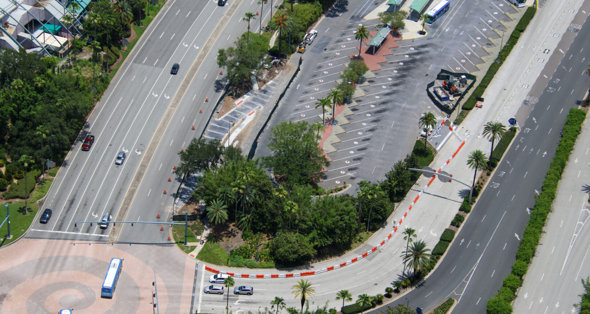 Construction is progressing on a new bus access lane outside Universal CityWalk Orlando, designed to give incoming buses a more direct path into the CityWalk bus terminal loop.
