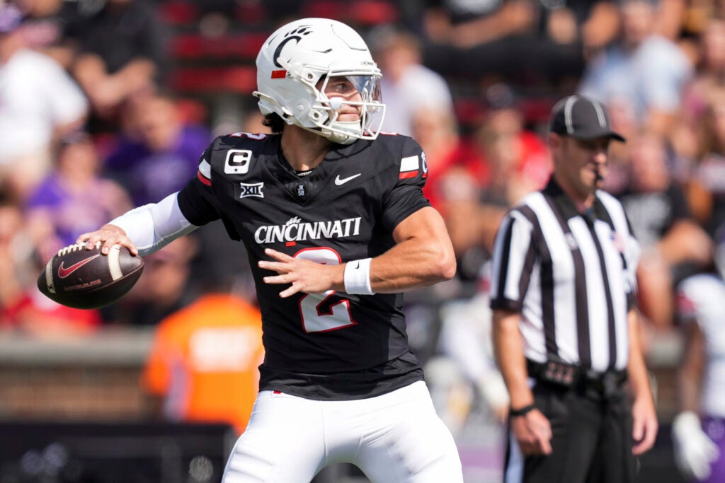 Sep 13, 2025; Cincinnati, Ohio, USA; Cincinnati Bearcats quarterback Brendan Sorsby (2) throws a pass for a touchdown against the Northwestern State Demons in the first half at Nippert Stadium.