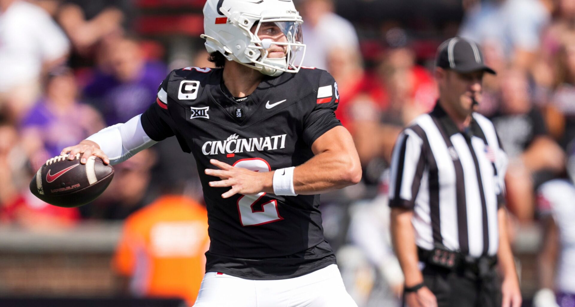 Sep 13, 2025; Cincinnati, Ohio, USA; Cincinnati Bearcats quarterback Brendan Sorsby (2) throws a pass for a touchdown against the Northwestern State Demons in the first half at Nippert Stadium.