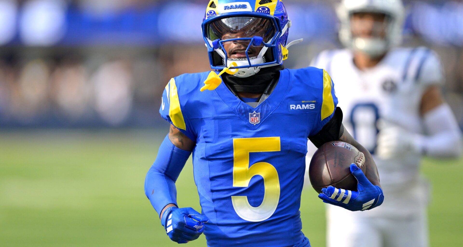 Sep 28, 2025; Inglewood, California, USA; Los Angeles Rams wide receiver Tutu Atwell (5) runs for a touchdown on an 88 yard pass play in the fourth quarter against the Indianapolis Colts at SoFi Stadium.