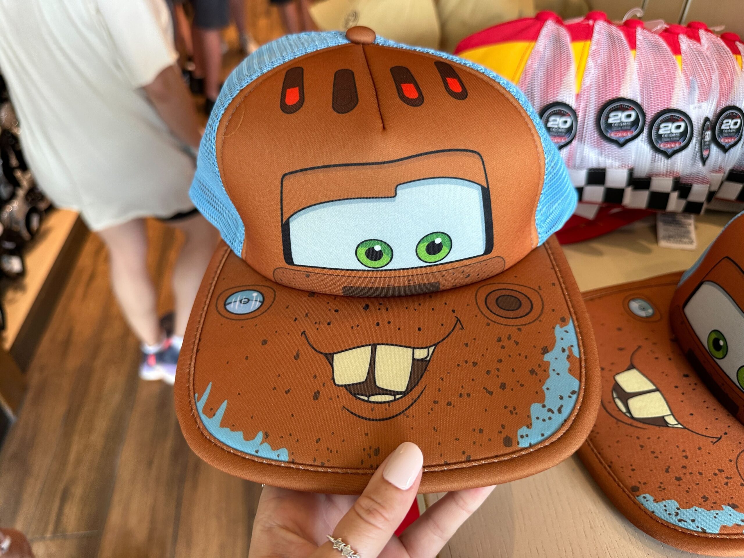 New Mater and Piston Cup Hats Race Into World of Disney at Disney Springs