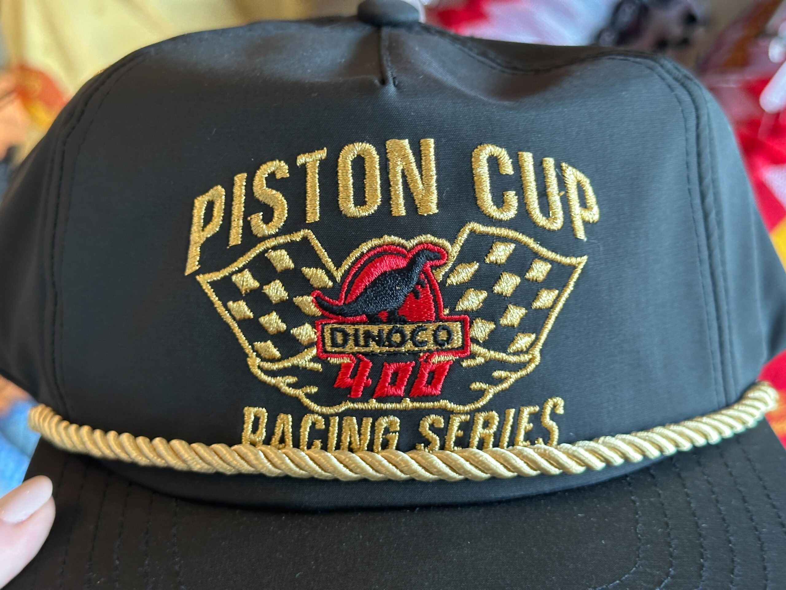 New Mater and Piston Cup Hats Race Into World of Disney at Disney Springs
