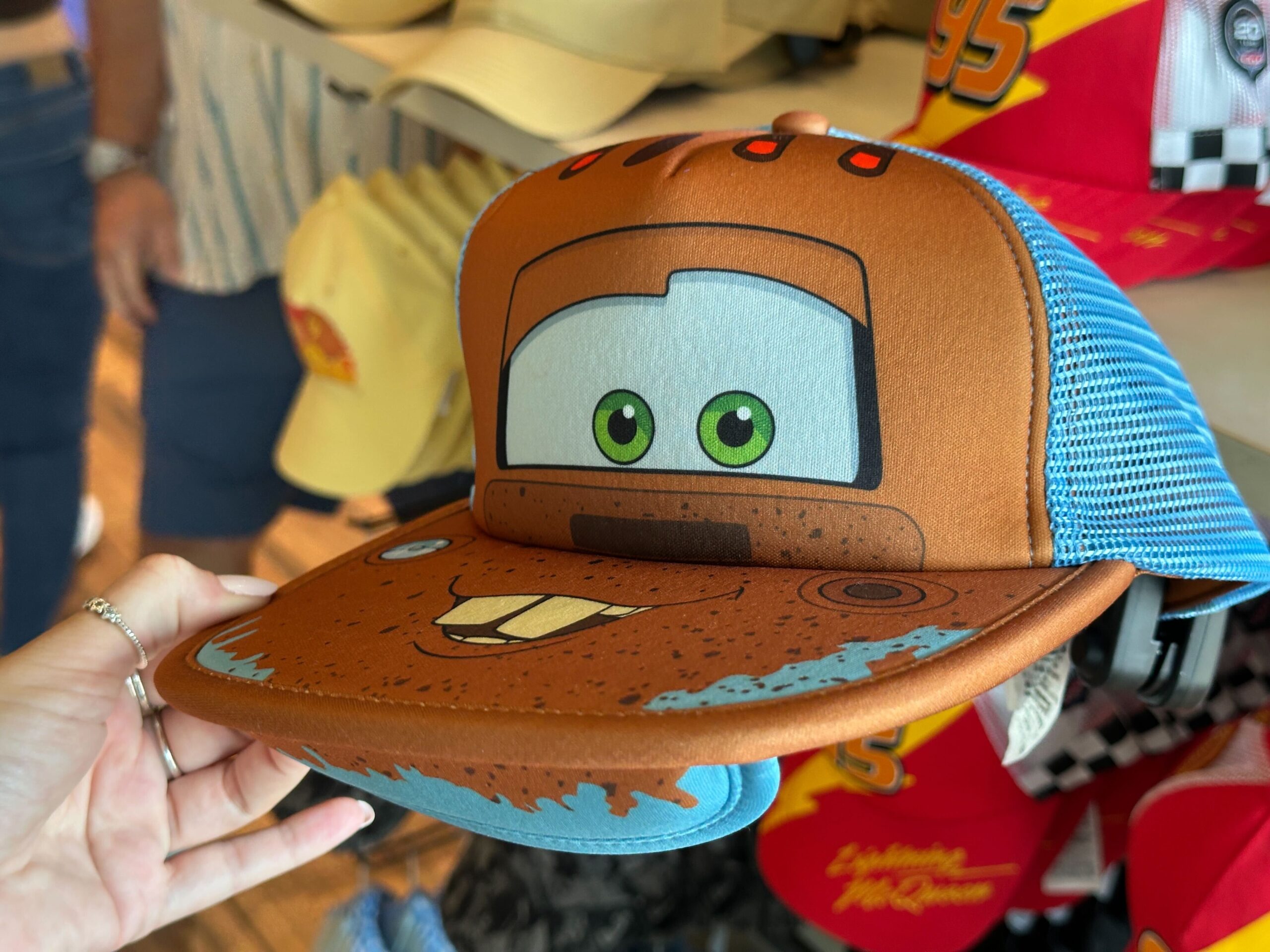 New Mater and Piston Cup Hats Race Into World of Disney at Disney Springs