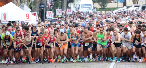 Runners take off for the start during the Watermelon 5K at Central Park in Winter Park on Tuesday morning, July 4, 2023. More than 2,500 runners and walkers participated in the event. (Stephen M. Dowell/Orlando Sentinel)User Upload Caption:
