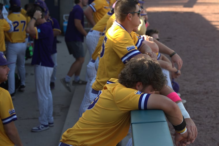 West Chester senior relief pitcher Patrick Taney and his fellow Golden Rams react after losing in the Division II championship game.