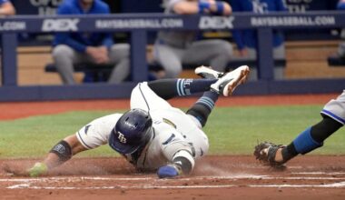 Tampa Bay Rays Yandy Díaz scores before the tag from Kansas City Royals catcher Salvador Perez during the first inning of a baseball game Tuesday, June 23, 2026, in St. Petersburg, Fla. (AP Photo/Jason Behnken)