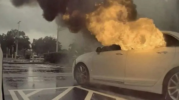 car on fire, children inside rescued