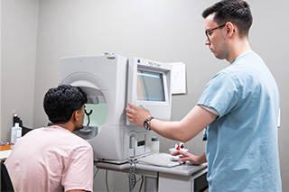 Patient is examined at machine