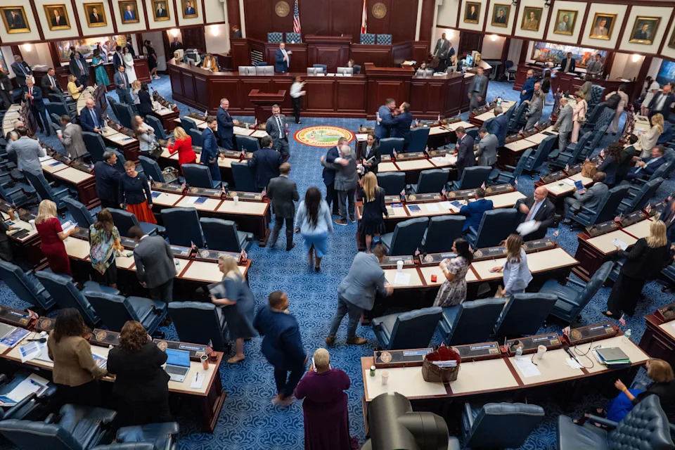 Representatives pack up, hug one another and head out the chamber doors after completing a special session regarding property taxes Tuesday, June 2, 2026.
