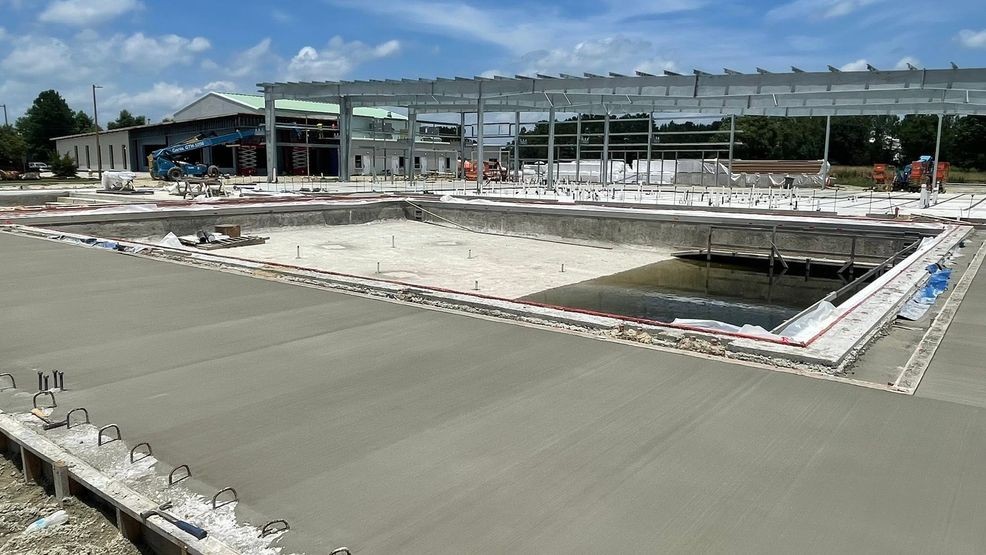 {p}The new New River YMCA - Onslow aquatic center continues to take shape.{/p}{p}Crews recently poured the new cement apron around the pools.{/p}