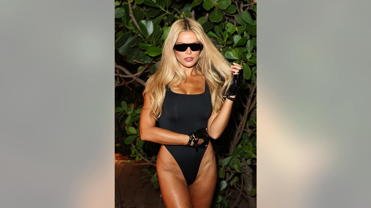 Brooks Nader walking on the red carpet at Sports Illustrated Swimsuit Runway Show in Miami Beach