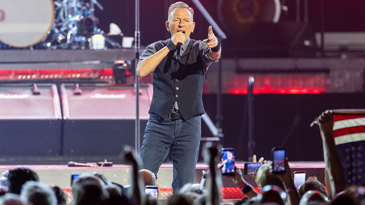 Bruce Springsteen and the E Street Band performing on stage at the Kia Forum in Inglewood