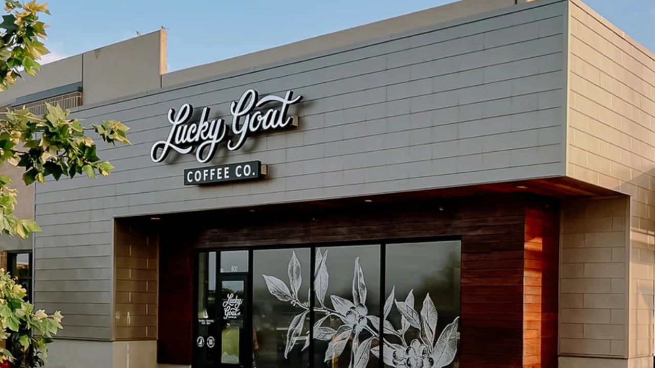 Exterior of a Lucky Goat Coffee café with the company's signage above the entrance.
