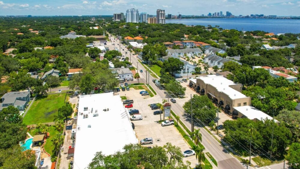 Aerial view of St. Croix Plaza on South MacDill Avenue in South Tampa, with Tampa Bay visible in the background.