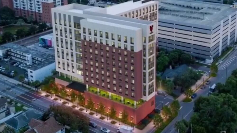 Rendering of the University of Tampa's planned 11-story student housing development at 110 South Boulevard, featuring 238 units, 833 beds and ground-floor dining and student services.