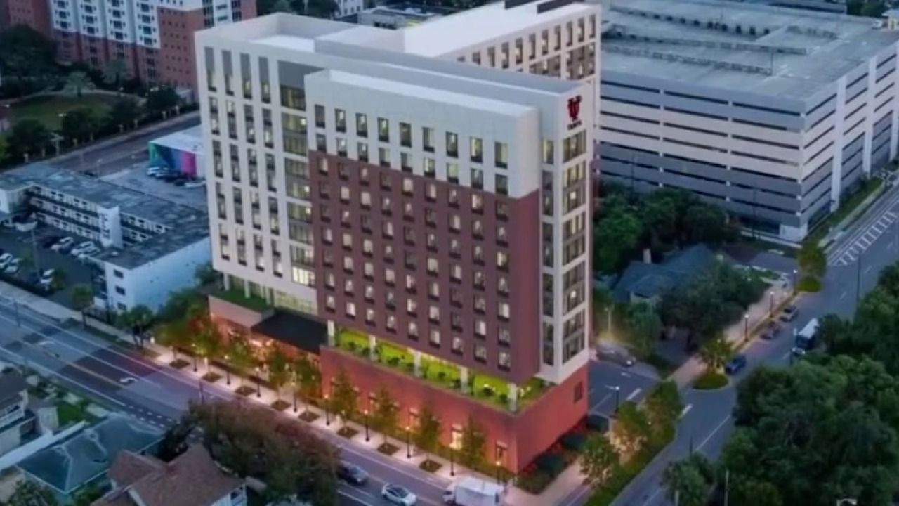 Rendering of the University of Tampa's planned 11-story student housing development at 110 South Boulevard, featuring 238 units, 833 beds and ground-floor dining and student services.