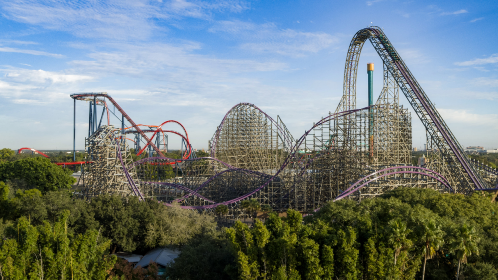 Aerial view of Busch Gardens Tampa Bay with Iron Gwazi and other roller coasters rising above the park's landscape.