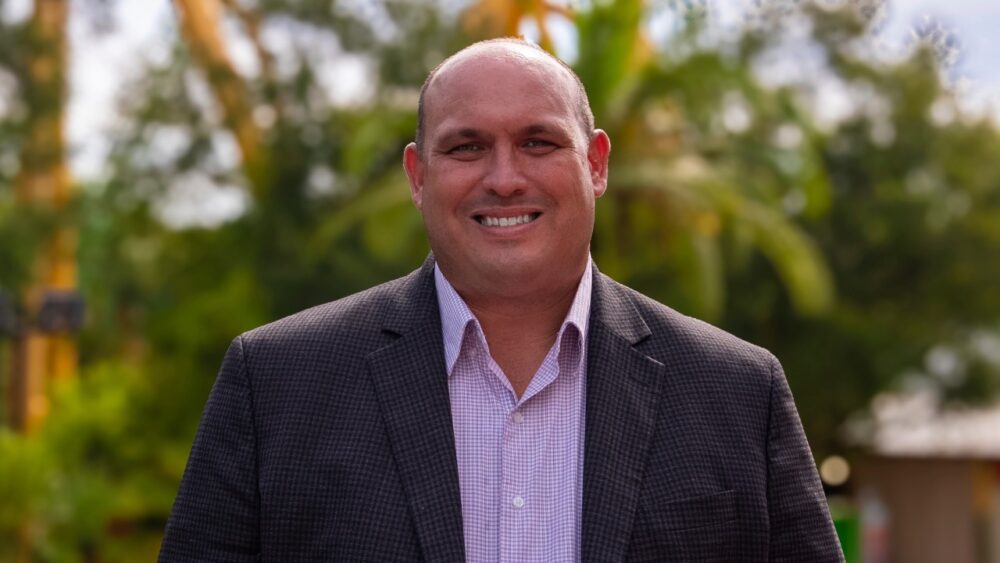 Jon Vigue, newly appointed president of Busch Gardens Tampa Bay, stands outdoors at the park.