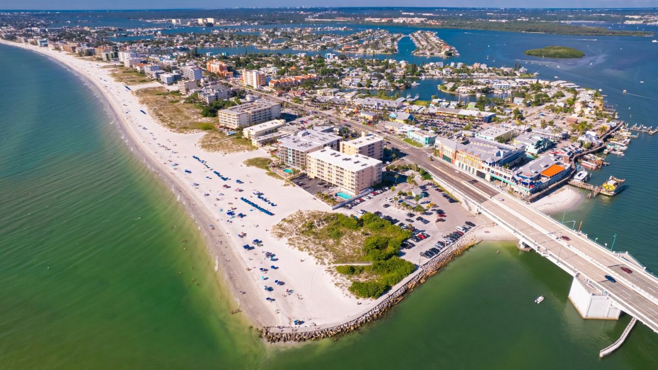 Aerial view of Madeira Beach showing Gulf Boulevard, John's Pass Village and the Gulf of Mexico shoreline.