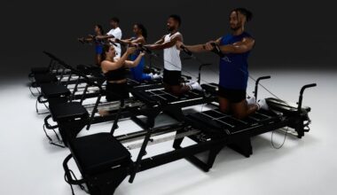 Participants perform a Solidcore strength-training class on reformer machines during a group workout session.