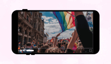 Graphic of cell phone with a Pride Parade photo displayed on the screen.