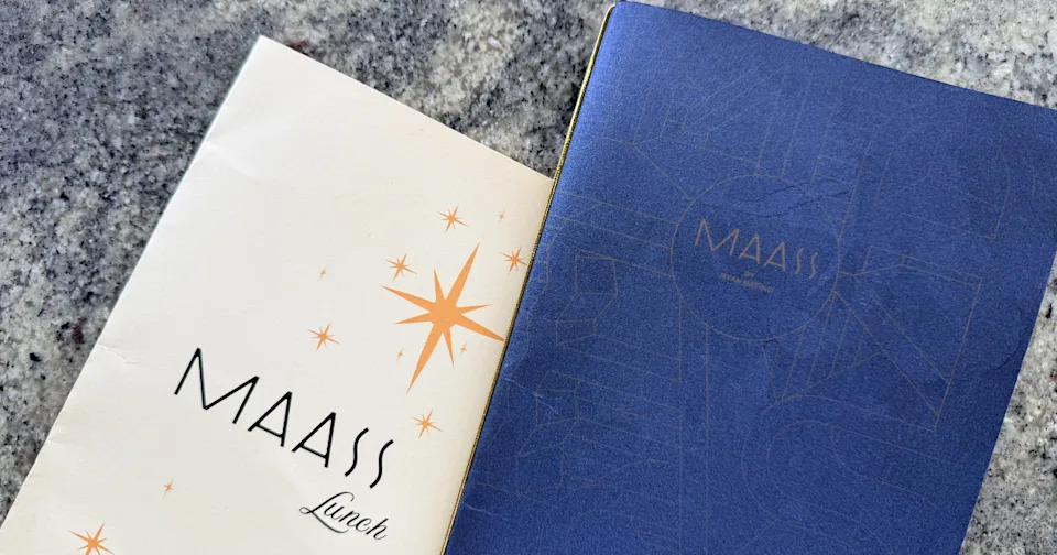 A close-up view of the printed weekend brunch menu at MAASS restaurant.