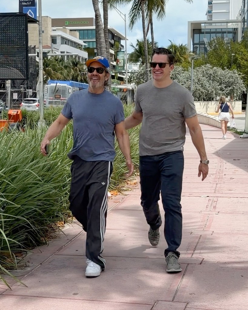 Andy Cohen and Kevin Sobieski smiling during a Miami getaway.