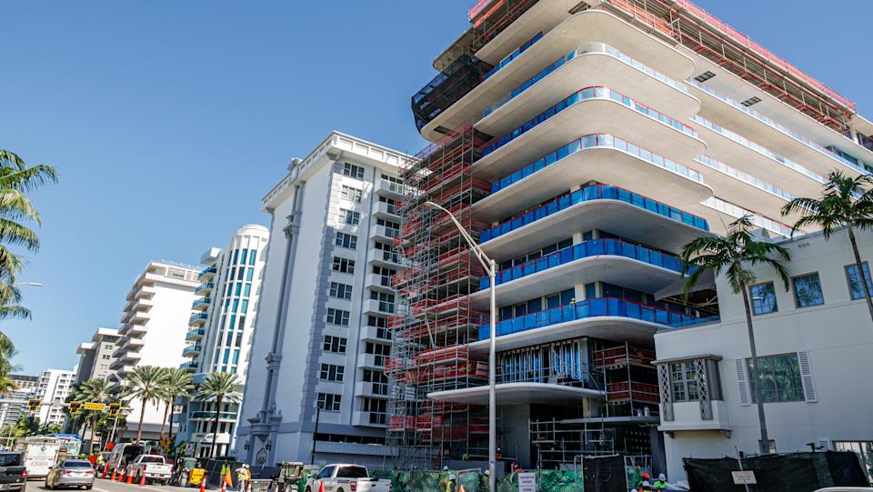 Exterior of high rise buildings with one under construction on Collins Avenue, Surfside, Florida.