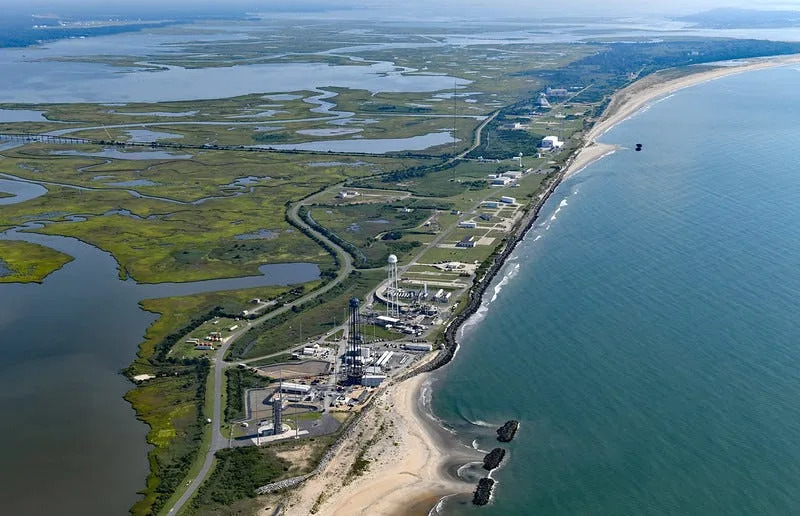 An overhead photo depicts Rocket Lab's side-by-side launch complexes located at the Wallops Flight Facility in Virginia.