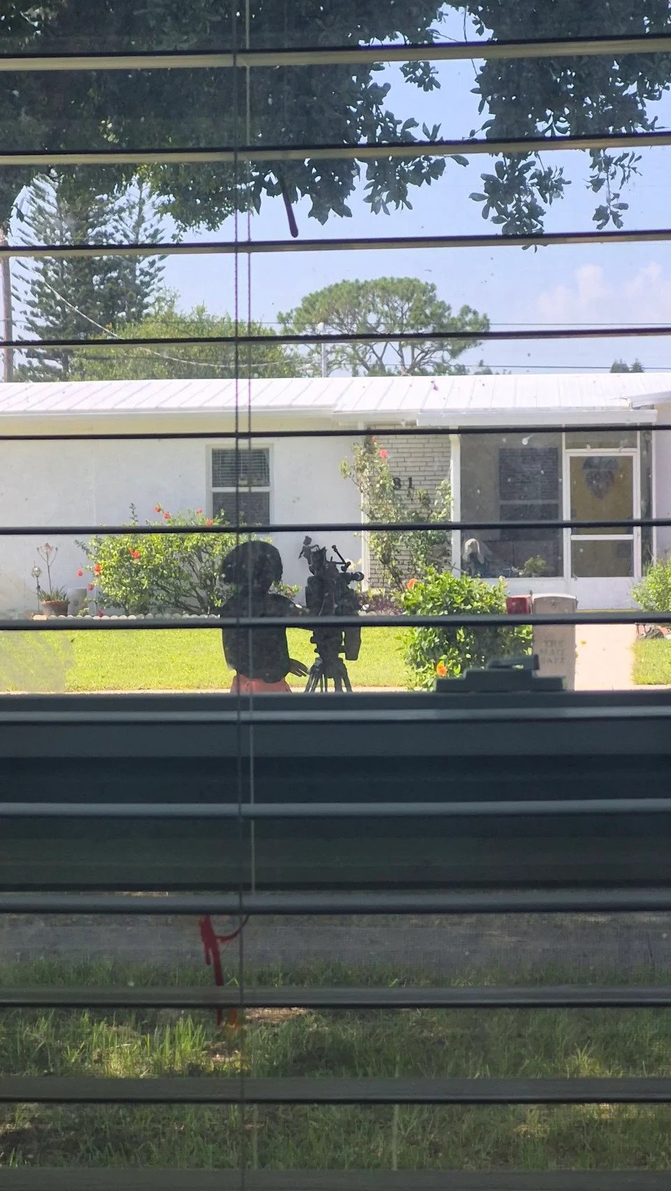 CBS12 reporter stands outside the Port St. Lucie home where a fatal driveway SUV accident occurred.