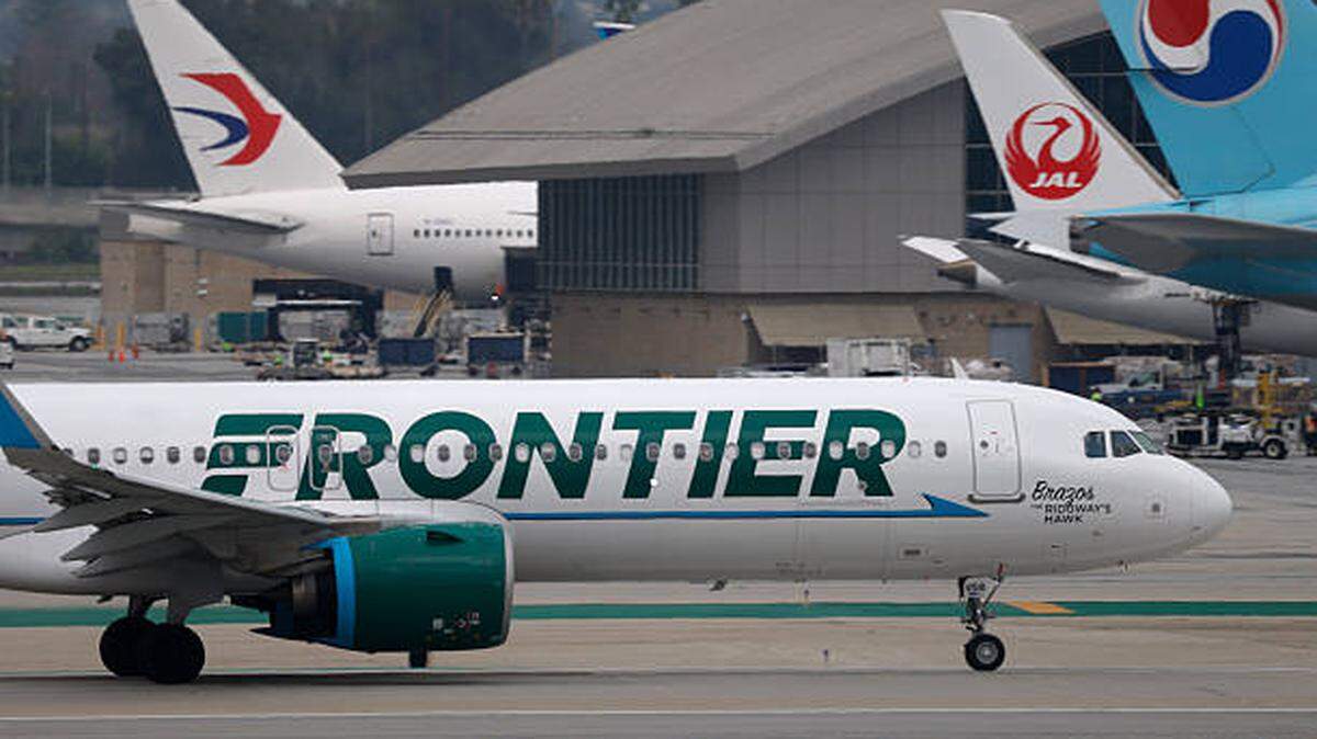 A Frontier Airlines flight was diverted to Miami on Sunday after a man attempted to open an exit door mid-flight. A Frontier Airlines flight was diverted to Miami on Sunday after a man attempted to open an exit door mid-flight.