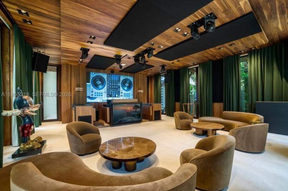 A lounge outfitted with DJ equipment is one of the amenities at John Ruiz’s Gables Estates home.