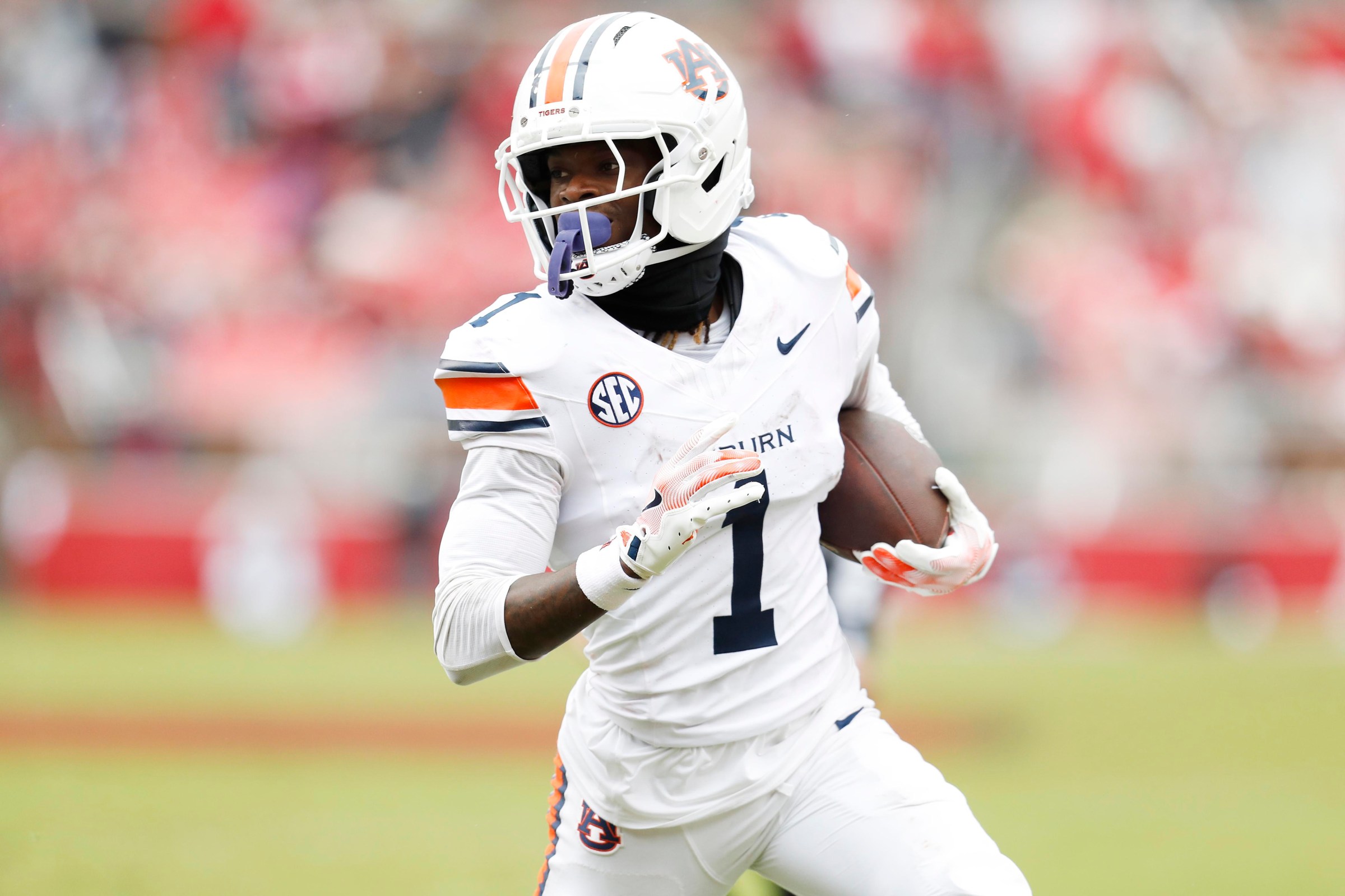 FAYETTEVILLE, AR - OCTOBER 25: Auburn Tigers wide receiver Eric Singleton Jr. (1) carries the football during the college football game between the Auburn Tigers and Arkansas Razorbacks on October 25, 2025 at Donald W. Reynolds Razorback Stadium in Fayetteville, Arkansas. (Photo by Andy Altenburger/Icon Sportswire via Getty Images)