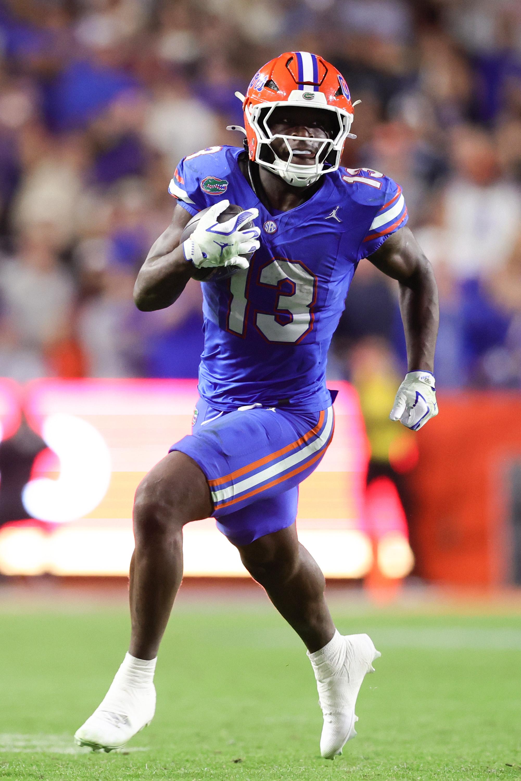 GAINESVILLE, FLORIDA - NOVEMBER 29: Jadan Baugh #13 of the Florida Gators carries the ball against the Florida State Seminoles during the second half of the game at Ben Hill Griffin Stadium on November 29, 2025 in Gainesville, Florida. (Photo by Megan Briggs/Getty Images)