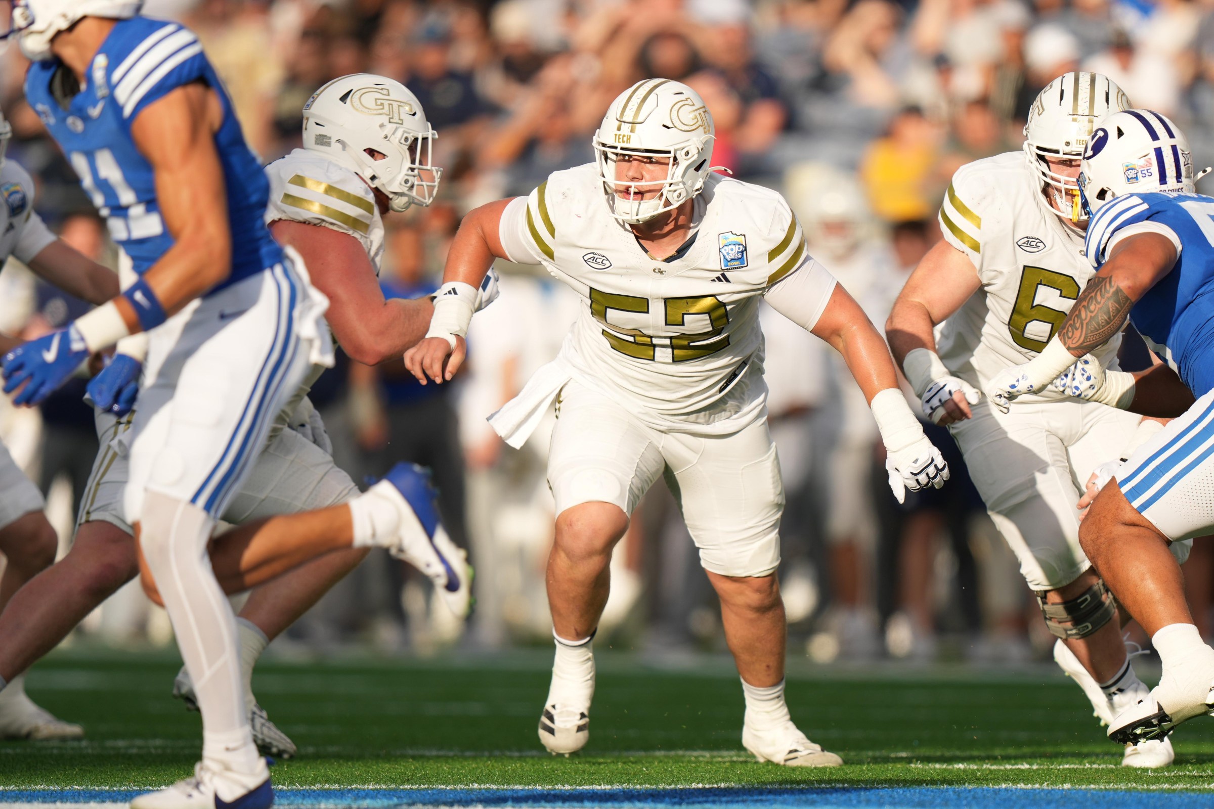 ORLANDO , FL - DECEMBER 27: Georgia Tech Yellow Jackets offensive guard Harrison Moore (52) run blocks during the Pop-Tarts Bowl between BYU Cougars and the and the Georgia Tech Yellow Jackets on Saturday, December 27, 2025 at Camping World Stadium in Orlando, FL. (Photo by Peter Joneleit/Icon Sportswire via Getty Images)
