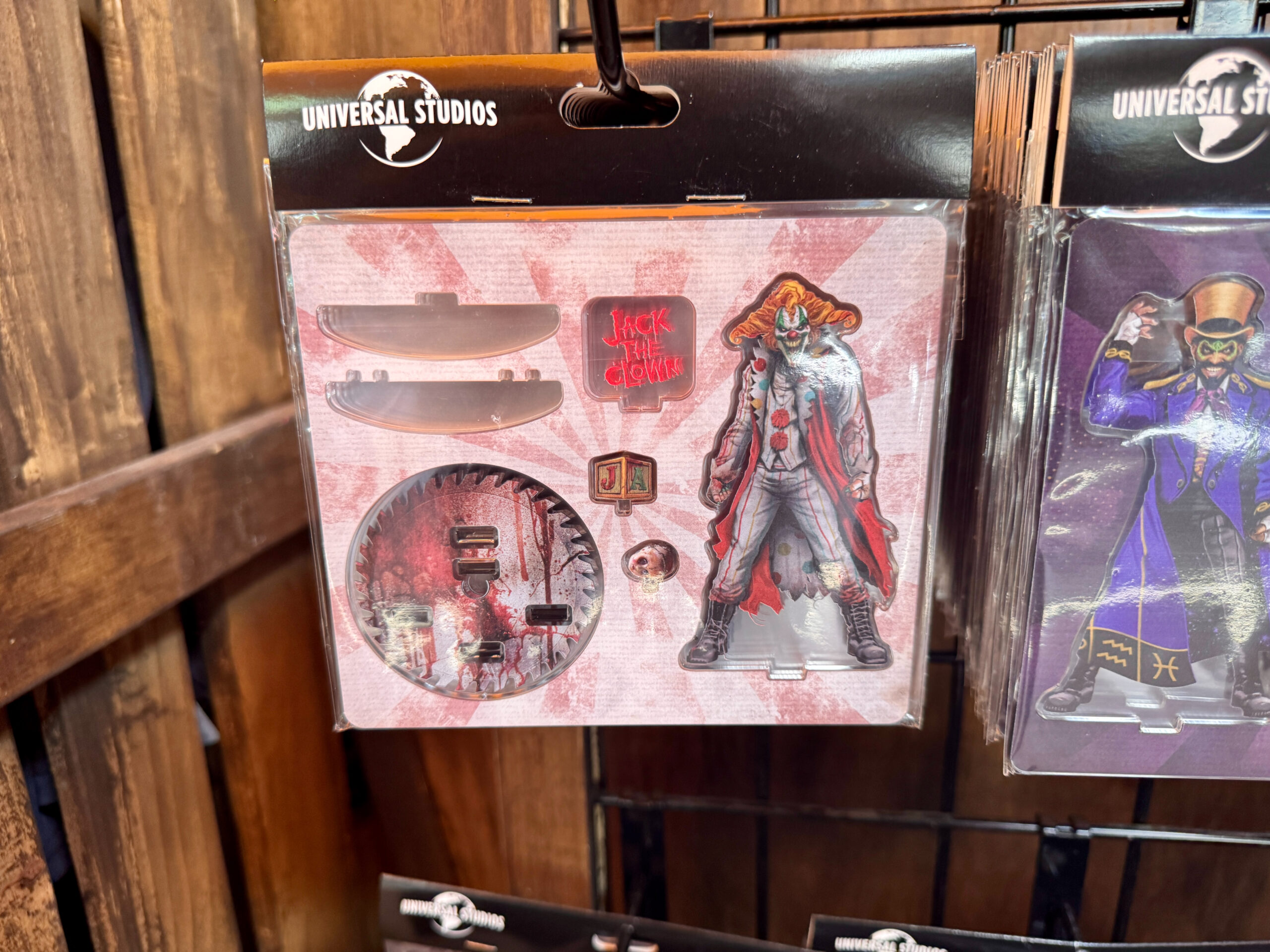 This acrylic stand-up figure of Jack the Clown has the character, a doll head, a toy block with