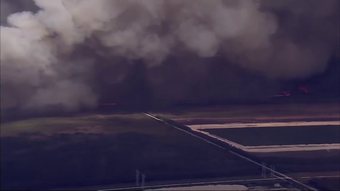 2 wildfires burn 13,900 acres in western Miami-Dade — smoke pollutes air