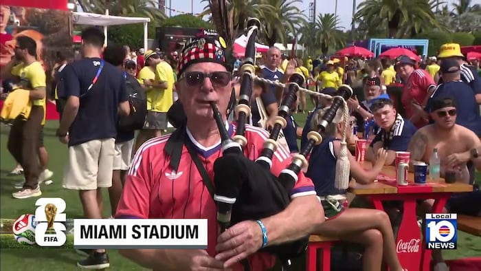 Brazilian and Scottish FIFA World Cup fans celebrate together at Miami Stadium’s fan zone