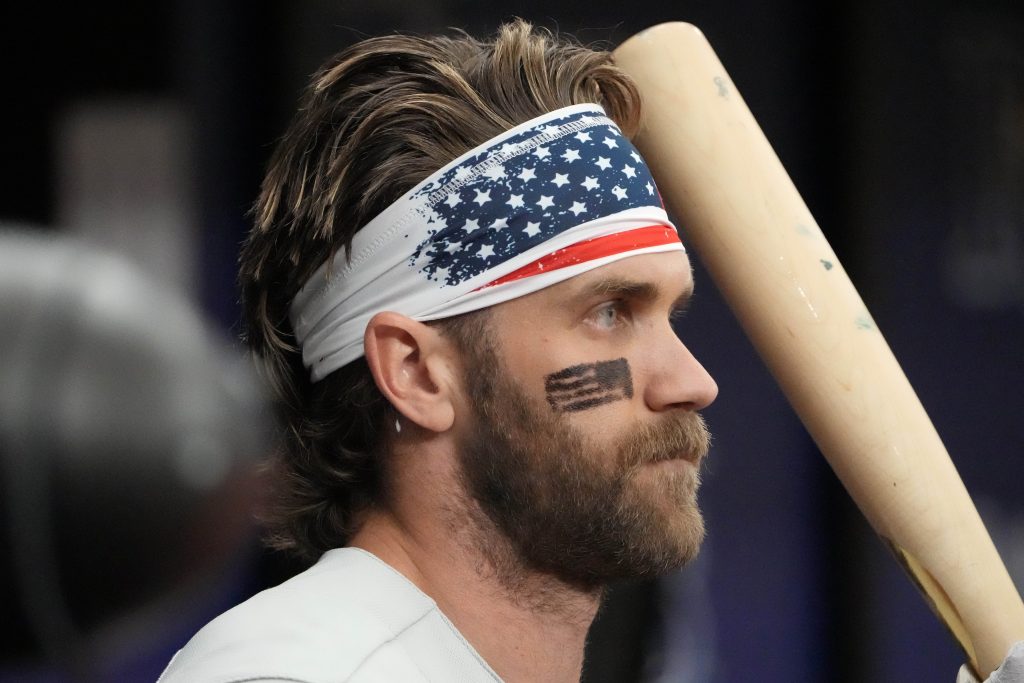 Jul 4, 2023; St. Petersburg, Florida, USA; Philadelphia Phillies designated hitter Bryce Harper (3) wears a patriotic headband while he waits to bat against the Tampa Bay Rays during the first inning at Tropicana Field.