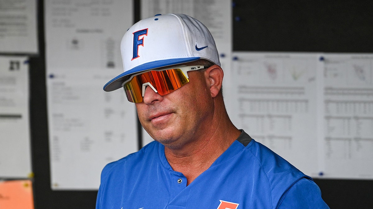 Florida Gators head coach Kevin O'Sullivan looking over the field at Charles Schwab Field Omaha
