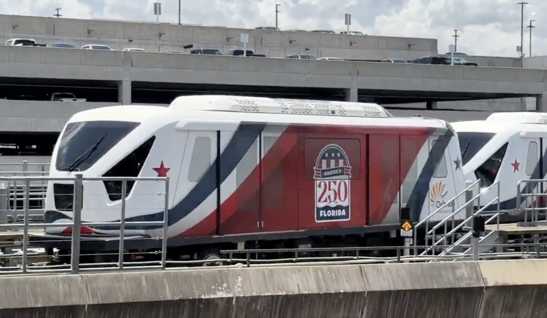 The Terminal Link train is now wrapped in red, white, and blue decals featuring an