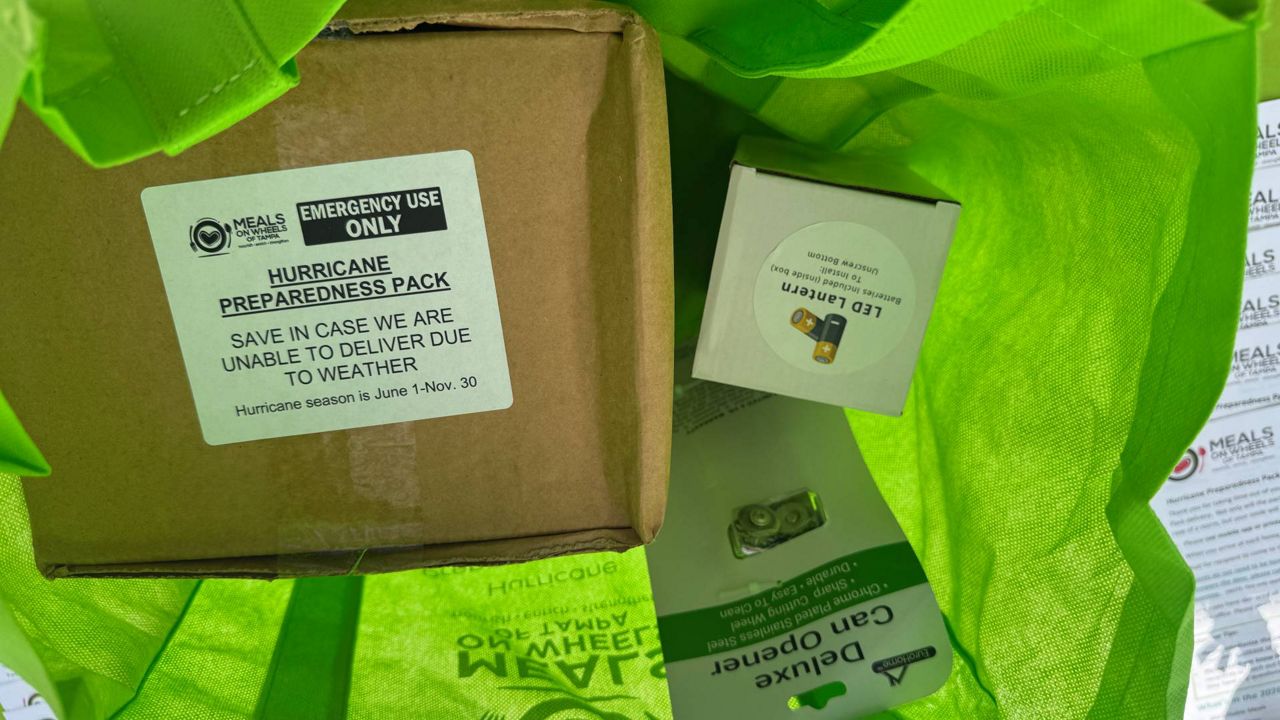 Meals on Wheels hurricane preparedness packs include shelf-stable meals, water, a manual can opener, a lantern, first-aid supplies and other information. (Spectrum News/Julia Hazel)