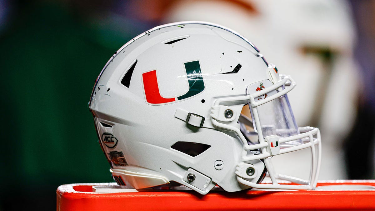 Miami Hurricanes helmet sitting on bench at Kenan Memorial Stadium