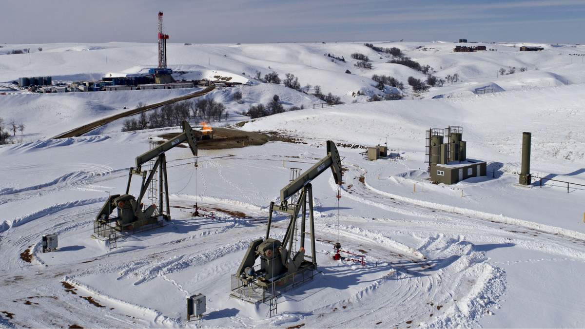 A Shale-Oil Boomtown As Oil Bust Proves To Be Good Pumpjacks operate as a drill rig sits on a well pad in the Bakken Formation in Williston, North Dakota.