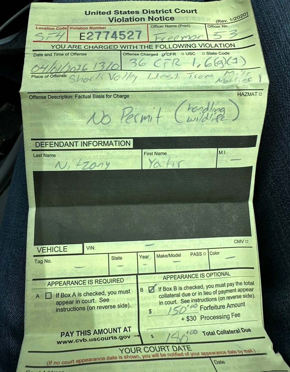 A citation issued to a Florida man for picking up a python without a permit.