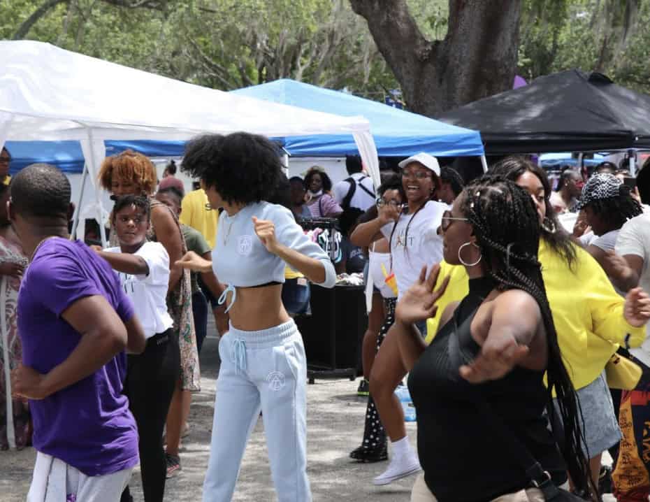 People dancing at an outdoor festival