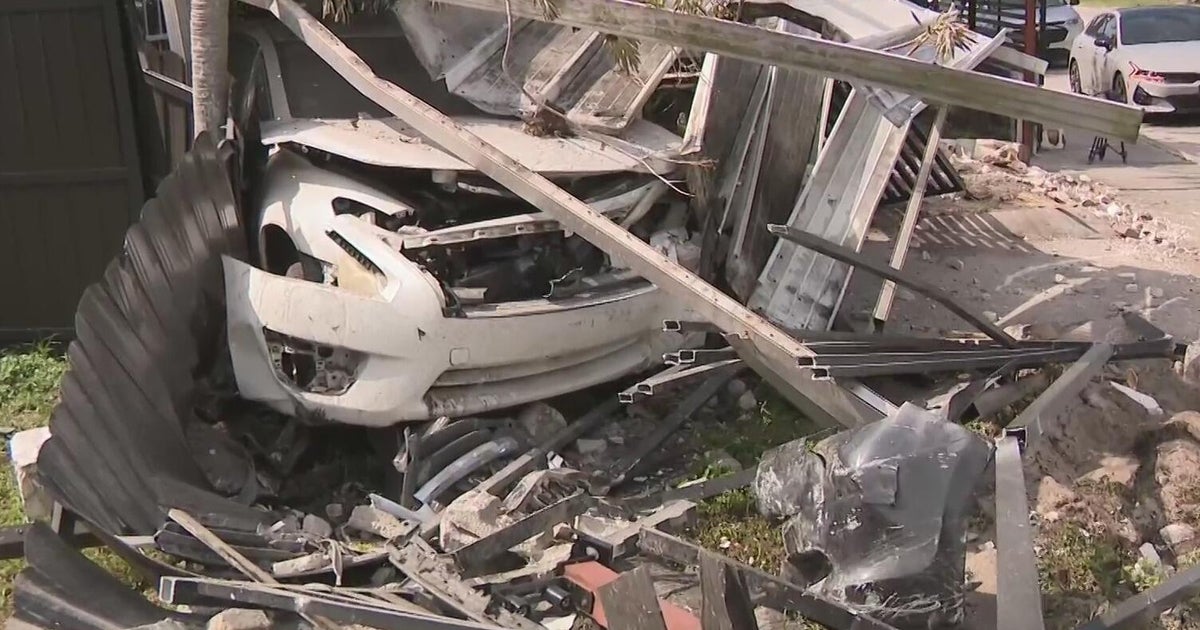 Car veers off road and crashes into a northwest Miami-Dade yard, nearly injuring multiple people