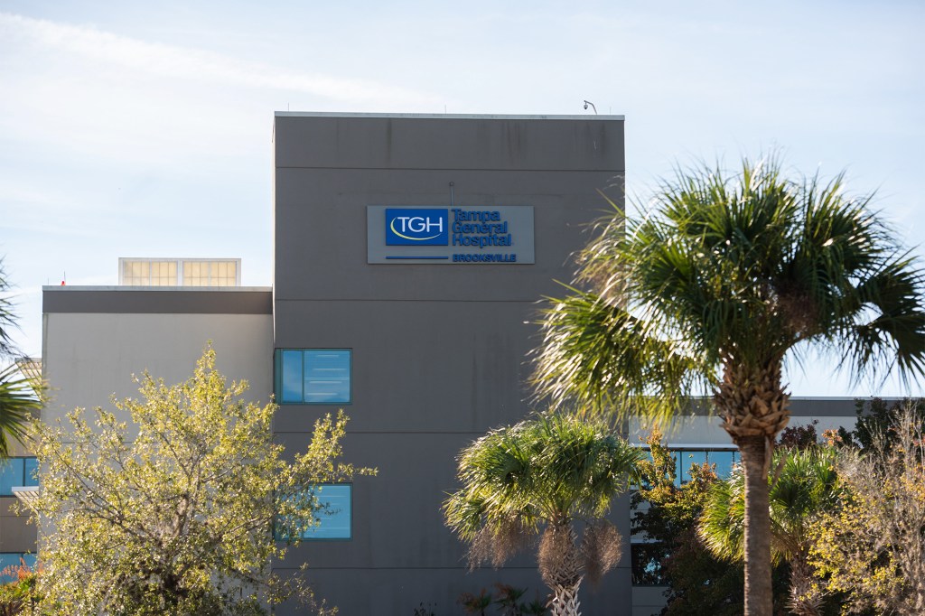 Signage for Tampa General Hospital in Brooksville on a building exterior.