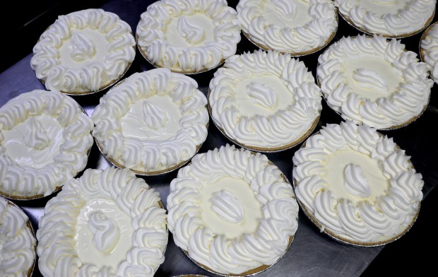 All Golbraykh puts the finishing touches on Key lime pies at Bob Roth's New River Groves on Thursday, June 18, 2026. (Mike Stocker/South Florida Sun Sentinel)